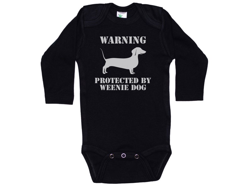 May include: Black long-sleeve baby onesie with a white dachshund silhouette and the text "WARNING PROTECTED BY WEENIE DOG".