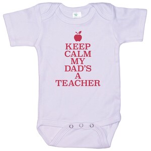 May include: A white baby onesie with a red apple and the text "Keep Calm My Dad's A Teacher".