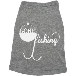 May include: Gray dog t-shirt with a white graphic of a fishing bobber with the word "GONE" inside and the word "fishing" below it. The graphic also includes a white fishing hook.