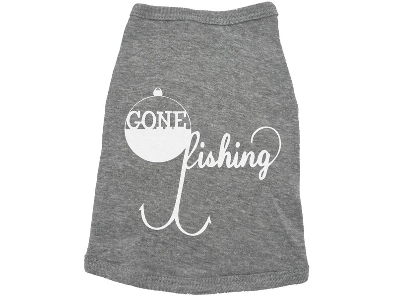 May include: Gray dog t-shirt with a white graphic of a fishing bobber with the word "GONE" inside and the word "fishing" below it. The graphic also includes a white fishing hook.