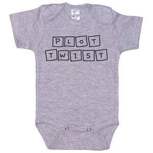 May include: Gray baby onesie with black text that reads "PLOT TWIST" in a blocky font.