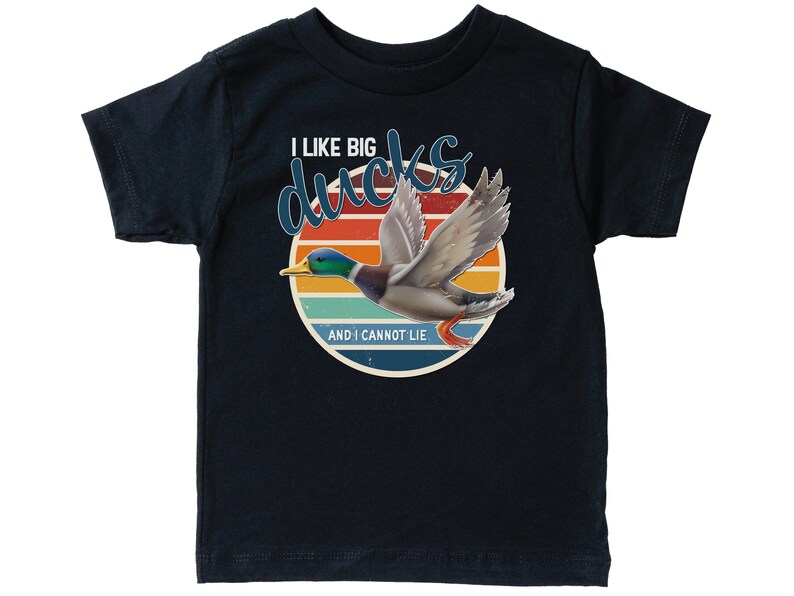 May include: A black t-shirt with a retro sunset graphic featuring a flying duck. The text "I like big ducks and I cannot lie" is printed on the shirt.