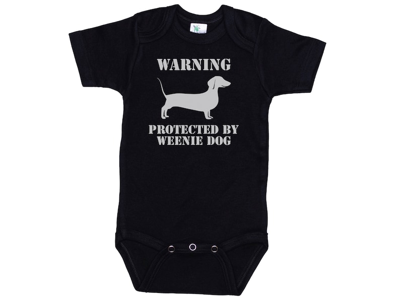 May include: Black baby onesie with a white dachshund silhouette and the text "WARNING PROTECTED BY WEENIE DOG".
