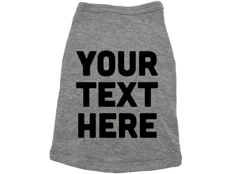 Op de afbeelding: Grijs honden T-shirt met zwarte tekst die "YOUR TEXT HERE" zegt.