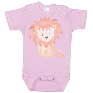 May include: A pink baby onesie with a watercolor illustration of a lion. The lion is orange and brown with a red mane.