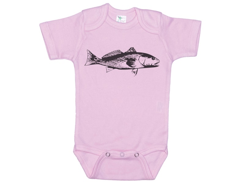May include: A pink baby onesie with a black and white illustration of a fish.