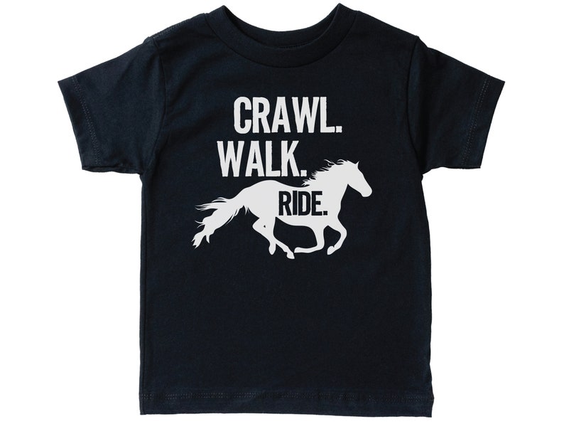 May include: A black t-shirt with white text that reads "Crawl. Walk. Ride." and a white silhouette of a horse running.