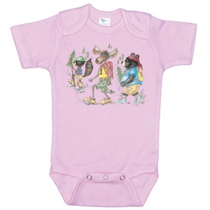 May include: Pink baby onesie with a graphic of a raccoon, moose, and bear wearing backpacks and hiking in the woods.
