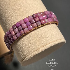 BRACELET made of tiny, faceted ruby beads, three-row, pink. Gemstone cube woven bracelet, macrame sliding knot, tassels, logo