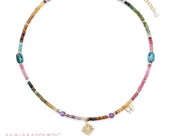 Necklace choker made of faceted tourmaline rondelles, amethyst coin pendant, and cubic zirconia set in sterling silver (925). Spring ring clasp.