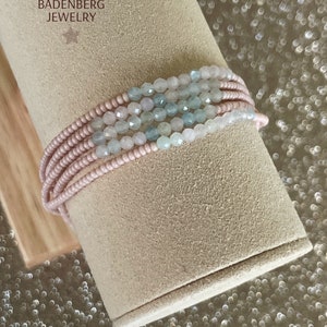 BRACELET made of faceted, light blue and pink morganite gemstones and Preciosa glass beads in warm blush, spacer and logo charm 24Kt gold plated