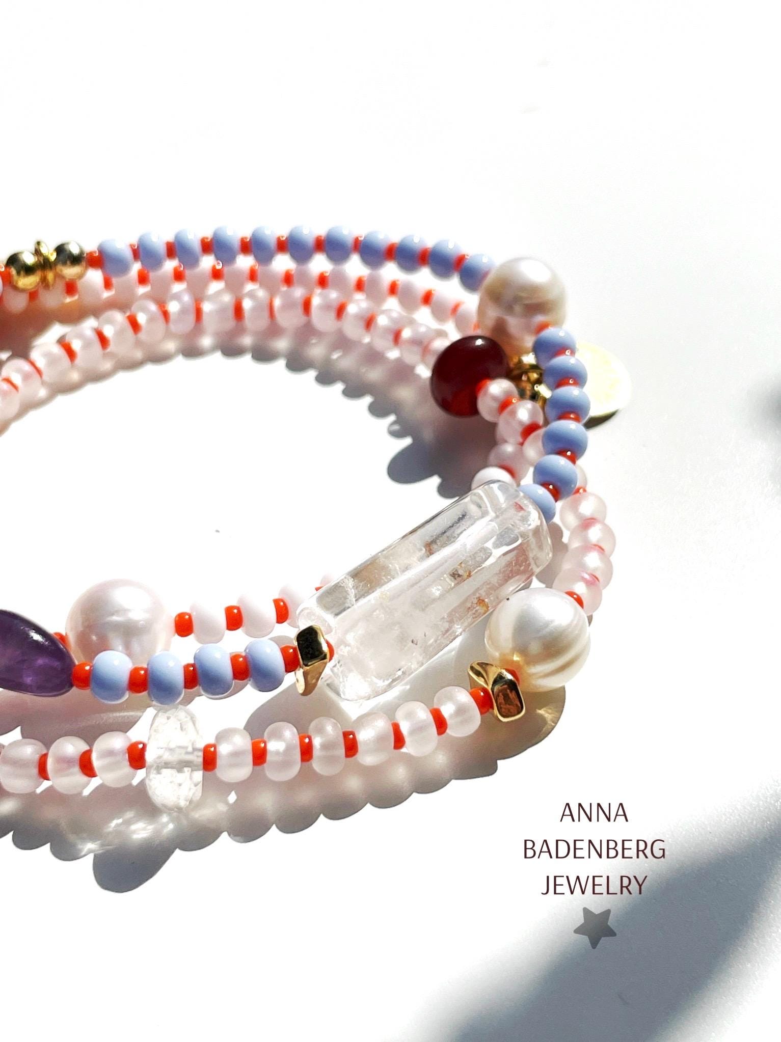 Free-form gemstone bracelet with Preciosa glass beads in sky blue, rock crystal, and turquoise, with 24-karat gold-plated elements. Choose from 3 designs.