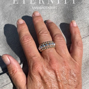 RING Trinity Ring in a set of 3 small, shining sterling silver balls 3 mm and 5 mm, partly 24Kt yellow gold plated