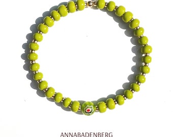 BRACELET made of glass beads (rocailles) in olive opaque and a millefiori bead, spacer 925 sterling silver 24K gold plated