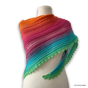 May include: A rainbow ombre crochet shawl with a scalloped edge. The shawl is draped over a white mannequin.