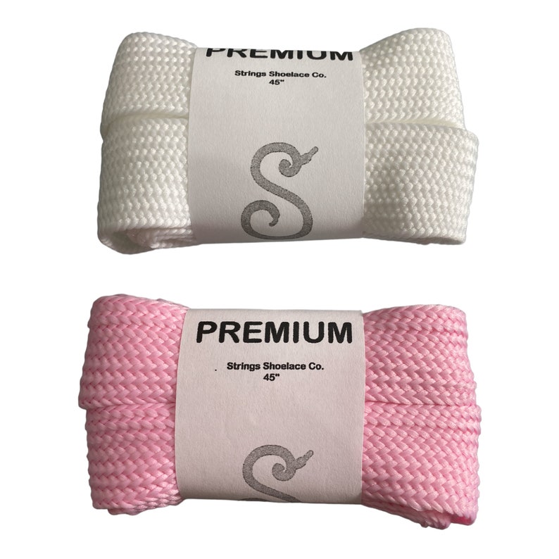 May include: Two pairs of shoelaces, one white and one pink, both 45 inches long. The shoelaces are made by Strings Shoelace Co. and are labeled "PREMIUM".