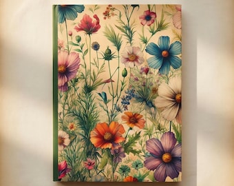May include: A floral journal with a green spine. The cover features a watercolor illustration of colorful flowers, including blue, pink, orange, and purple blooms, set against a cream-colored background. The design evokes a vintage aesthetic.