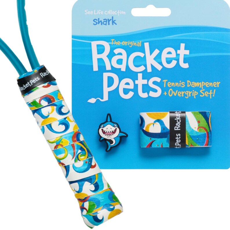 May include: A tennis racket grip set with a shark theme. The set includes a blue and white patterned grip, a shark-shaped charm, and a package with the text "Racket Pets". The grip is wrapped around a blue handle.