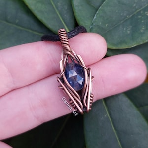 Small Wire Wrapped Faceted Kyanite Pendant In Oxidised Copper.