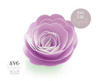 May include: A purple paper flower with multiple layers, resembling a rose. The flower is made of paper and has a white center.