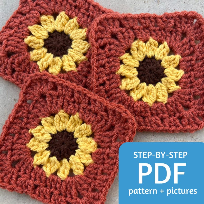 May include: Three crocheted sunflower squares in shades of brown, yellow, and red. The squares are stacked on top of each other. The text "STEP-BY-STEP PDF pattern + pictures" is at the bottom of the image.
