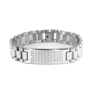 May include: A silver stainless steel bracelet with a rectangular plaque engraved with the Ten Commandments.