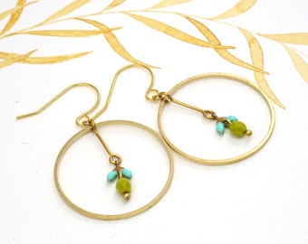 Earrings large circle brass with mint-colored leaves and apple green pearl