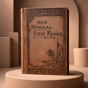 May include: A vintage-style book titled "New Normal First Reader" with decorative floral and geometric patterns on the cover. The book is brown and stands on a beige pedestal, set against a neutral background.