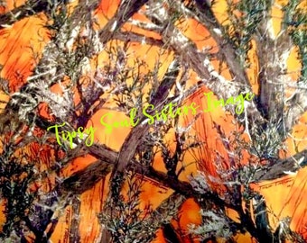 May include: A camouflage pattern in orange, brown, and green. The design features organic shapes resembling branches and foliage. The text "Tipsy Soul Sisters Image" is written in a cursive font.
