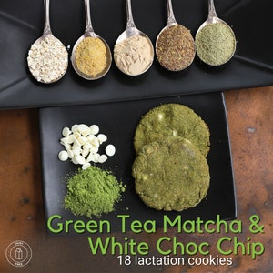 May include: A top-down shot of a black square plate with six silver spoons holding various ingredients, including oats and powders. Below, a pile of white chocolate chips, green powder, and two green cookies with white chips are arranged. Text reads "Green Tea Matcha & White Choc Chip".