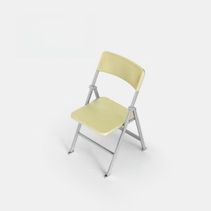 May include: A light yellow folding chair with a metal frame. The chair is folded and sitting on a white surface.