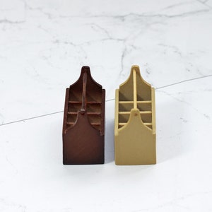 May include: Two wooden storage boxes with six compartments each. One box is brown and the other is beige.