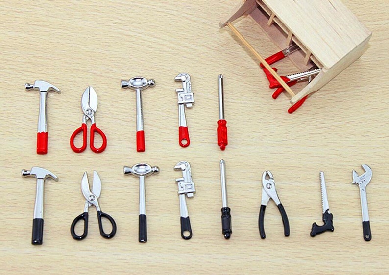 May include: A set of miniature tools, including a hammer, pliers, scissors, screwdrivers, and wrenches. The tools are made of metal and have red and black accents.