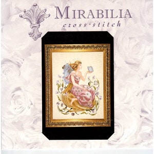 Puede incluir: Patrón de punto de cruz con un hada con una mariposa azul en un marco dorado. El patrón se titula "Mirabilia cross-stitch".