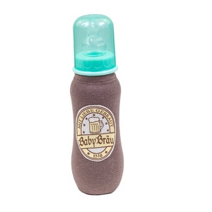 May include: A baby bottle with a brown fabric sleeve and a teal-coloured nipple and cap. The bottle has a label with the words "Baby Bräu" and a beer stein graphic. The bottle is designed to look like a beer bottle.