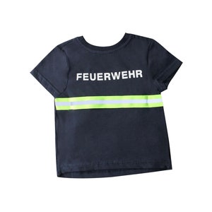 May include: A dark blue t-shirt with a white reflective stripe and the word "FEUERWEHR" printed in white.