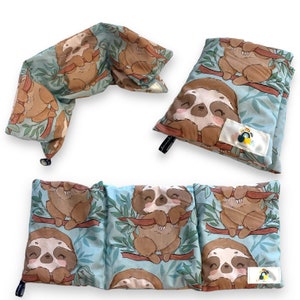 May include: Three different styles of pillows with a blue background and a pattern of sloths hanging from branches. The sloths are brown and have a light brown face with closed eyes. The pillows are made of soft fabric and are perfect for cuddling.