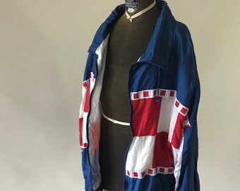 Vintage 1980s Red white and blue windbreaker with cotton knit lining.