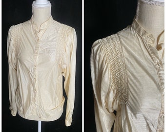 Vintage 1970’s funky cream blouse with micro pleating and puffy sleeves, size medium