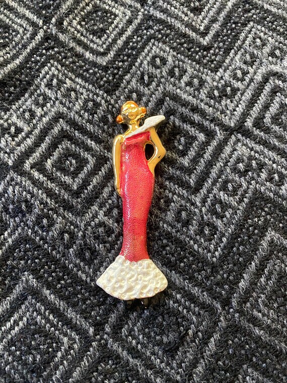 Vintage 1980’s standing woman in red dress brooch… - image 1