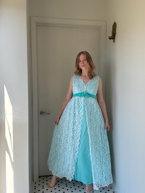 Vintage 1960s aqua blue formal dress with white scalloped lace, size medium