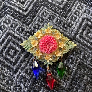 Vintage antique 1930’s celluloid floral brooch with hanging plastic gems