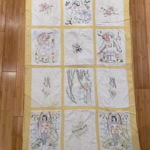 Vintage 1950’s yellow and white embroidered princess and fairytale quilt, kings and queens