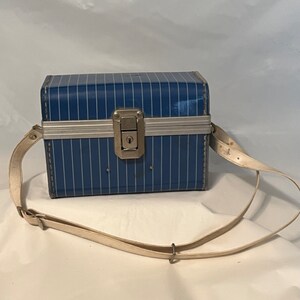 Vintage 1960's blue striped metal camera case with flashbulbs and instructions