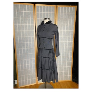 Vintage 1950’s gray dress with black velvet, tassels, and Peter Pan collar, size xs