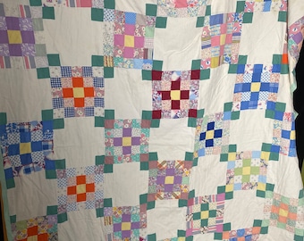 Vintage 1940’s square pattern quilt with green back