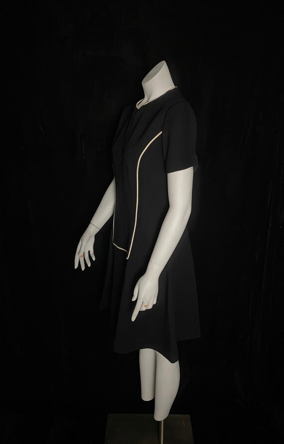 Black dress white piping 2025