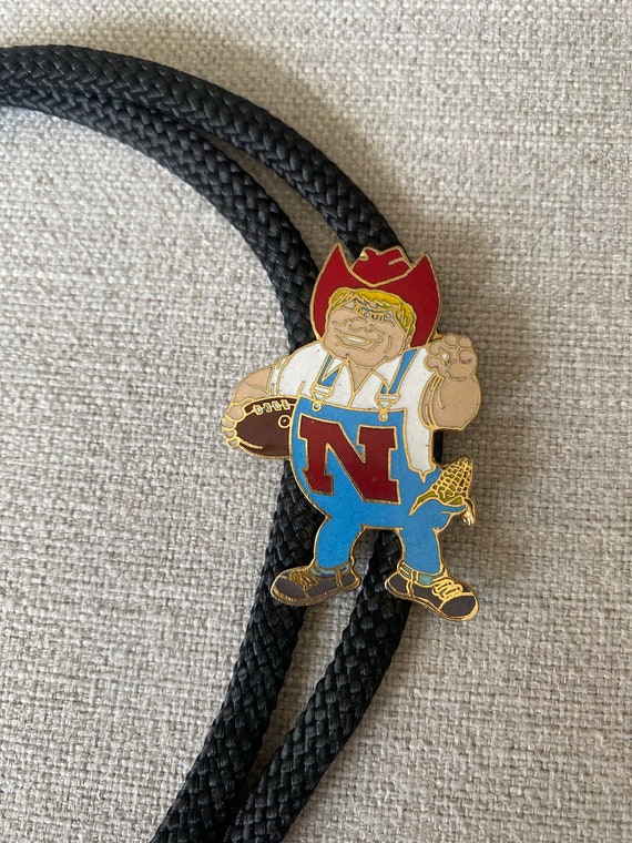 Vintage 1980's Black Nebraska Husker Football Herb