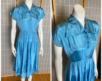 Vintage 1950’s sky blue satin dress with round glass buttons, size xs