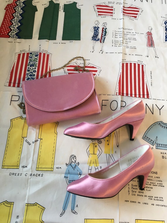 pink heels and clutch bag